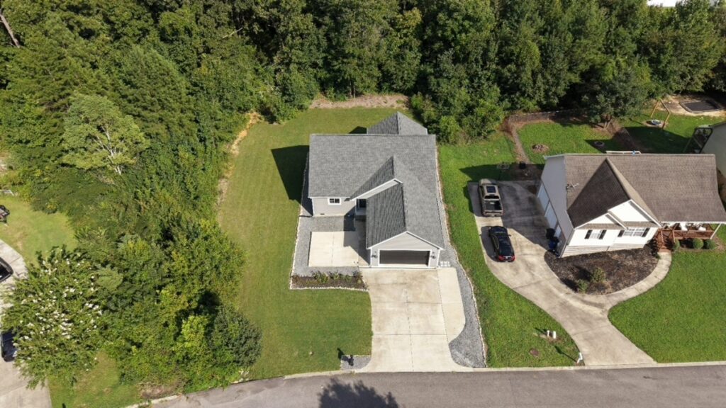 Aerial property photo before real estate photo editing services.