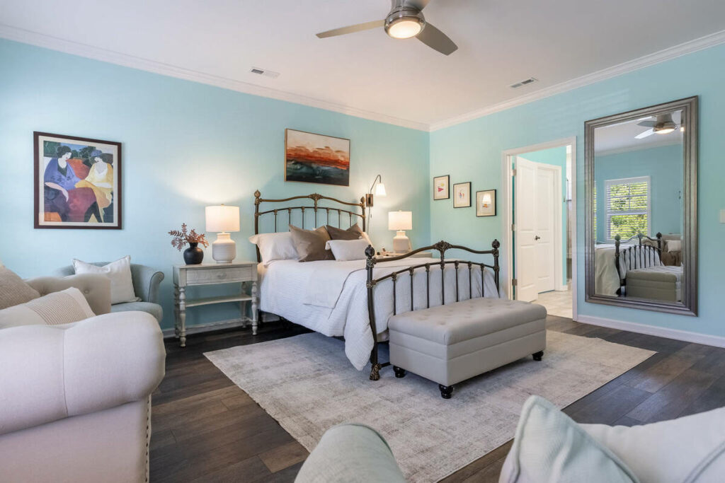 Primary bedroom enhanced with real estate photo editing services.