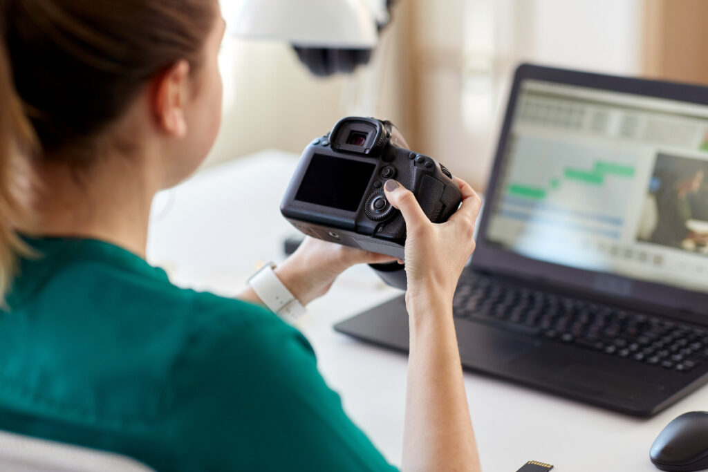 Photographer using AI photo editing tools as part of a digital editing workflow