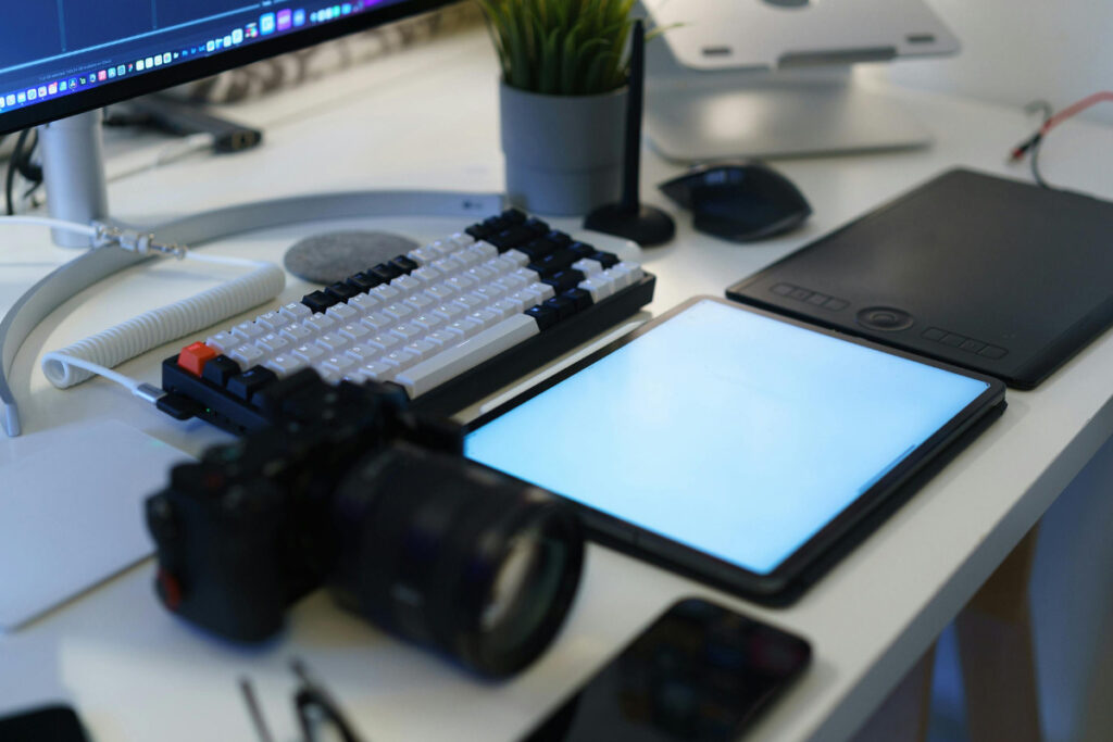 Photography workstation with camera equipment and AI photo editing tools