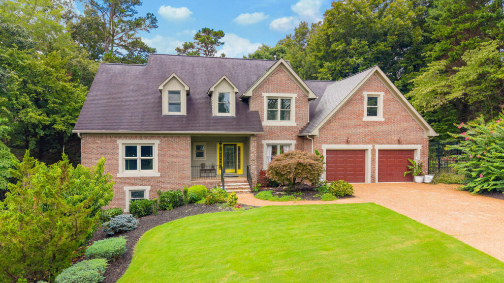 AI photo editing of a brick house exterior with enhanced color and lighting