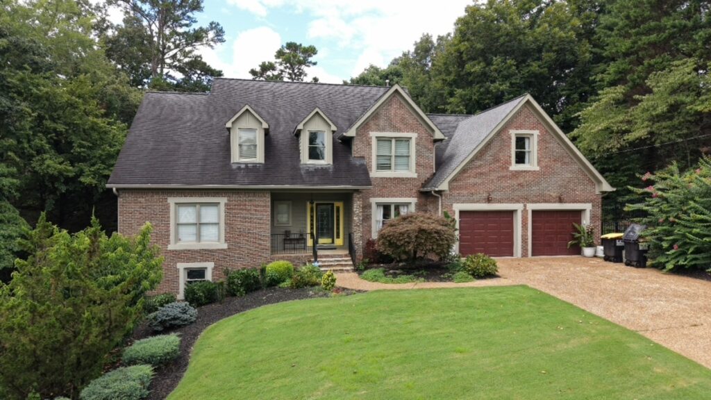 AI photo editing before enhancement of a brick house exterior