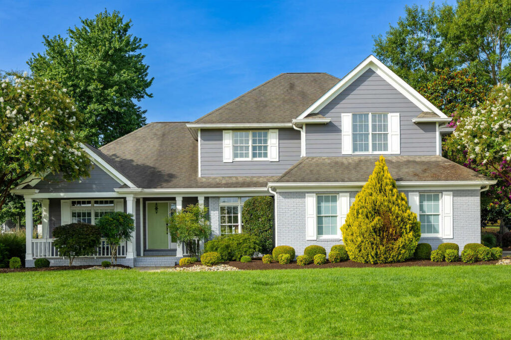 AI photo editing of a gray house exterior with enhanced lighting and color