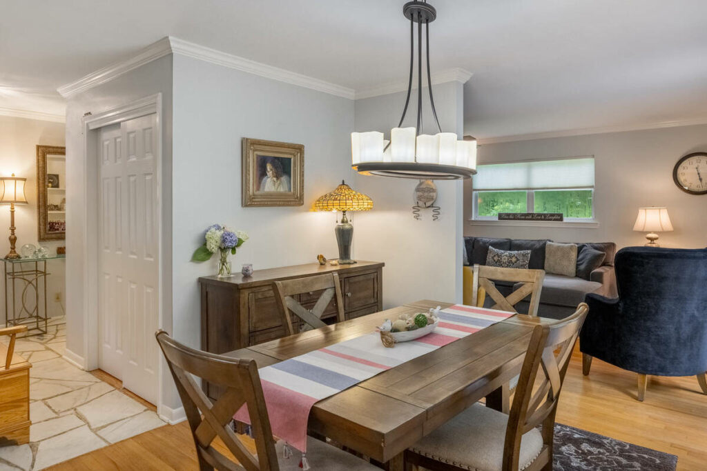 AI photo editing of a bright dining room and adjoining living space