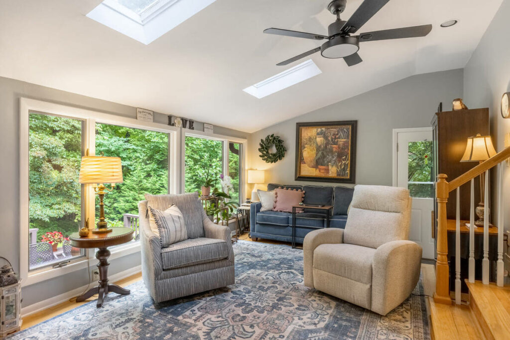 AI photo editing of a bright family room with large windows