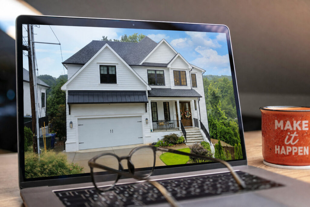 AI photo editing showing an exterior property photo on a laptop