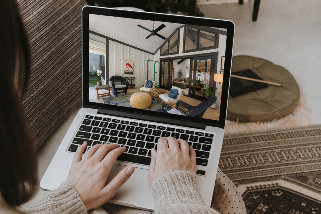 Real estate photo editing workflow with a property image on a laptop