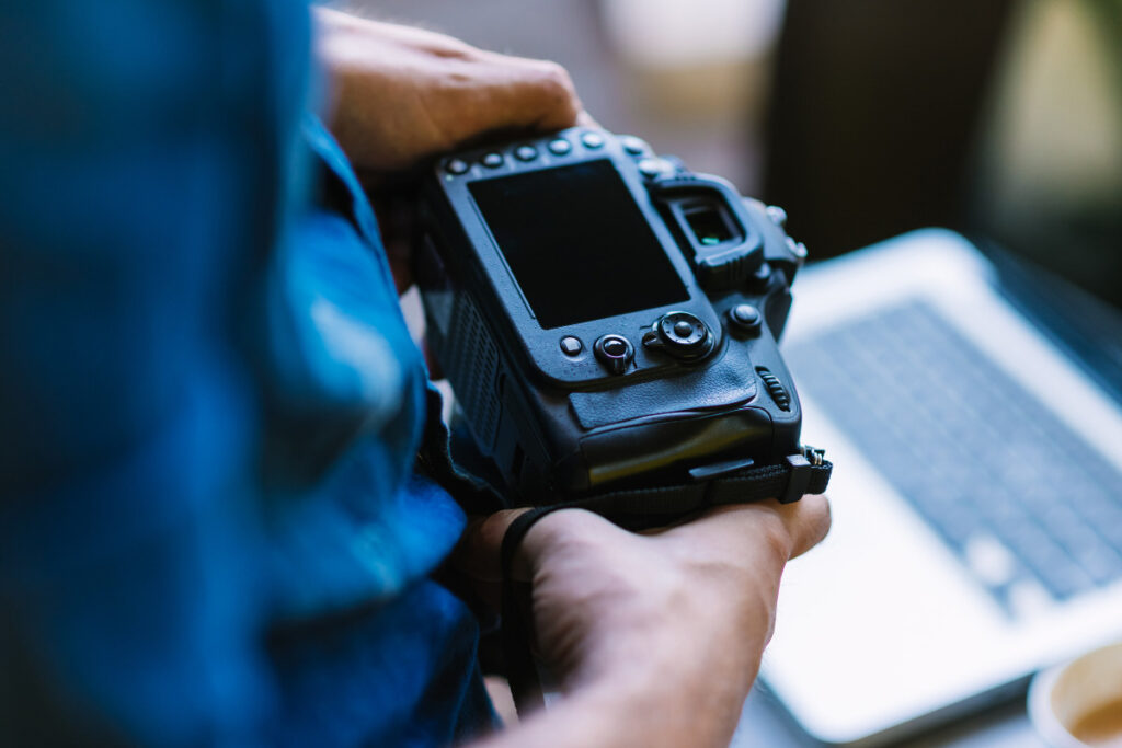 Photographer using a camera as part of an Imagen AI real estate workflow
