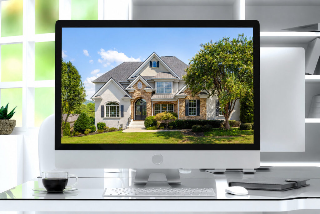 Exterior property photo displayed on a desktop monitor with an AI real estate photo editor
