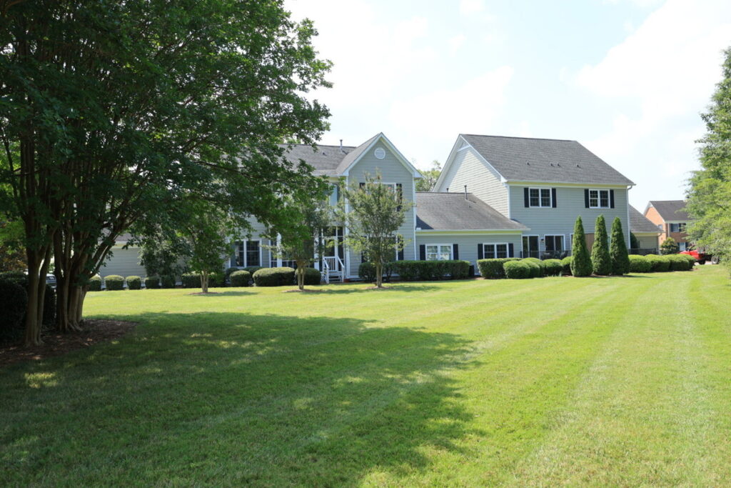 Original exterior property photo before AI real estate photo editor enhancement