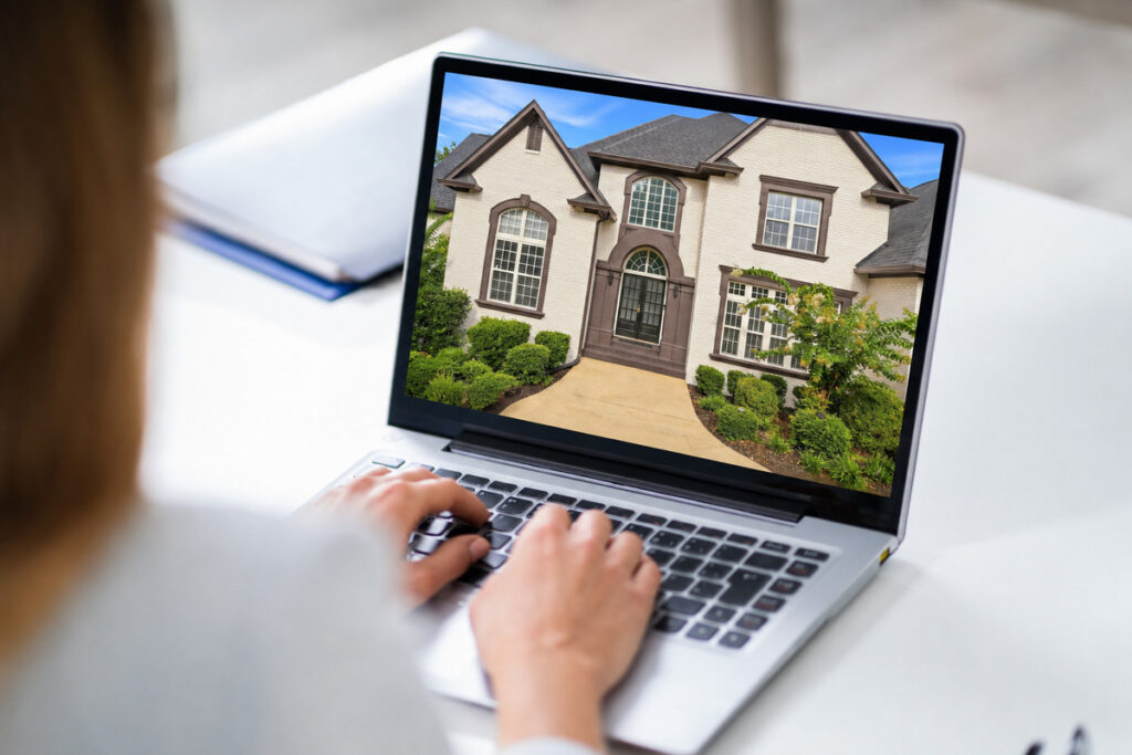 Architecture photography of a residential property displayed on a laptop screen.