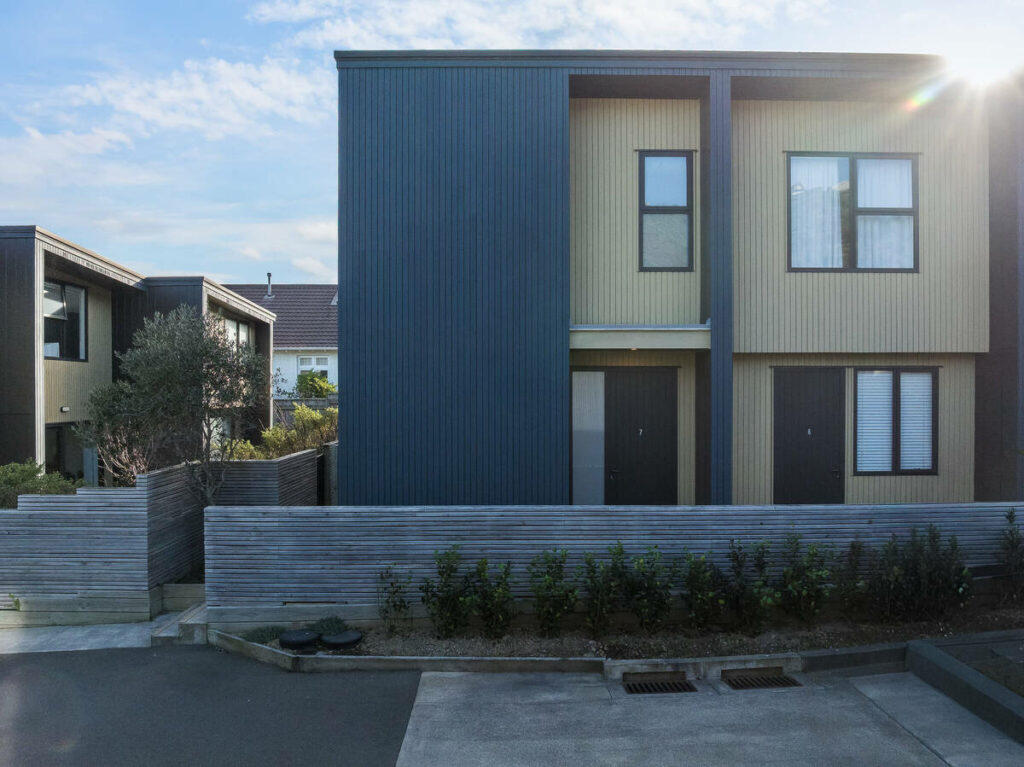 Architecture photography of a modern residential building with clean lines and contrasting siding.