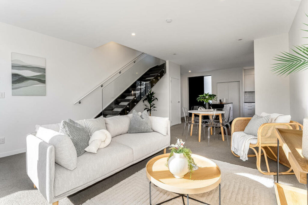 Architecture photography of a modern open-plan living and dining space with natural light.