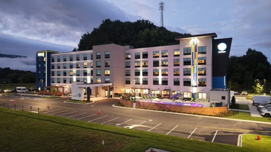 Architecture photography of a hotel exterior before twilight sky and lighting enhancements.