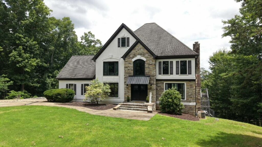 Architecture photography of a stone home exterior before professional photo editing.