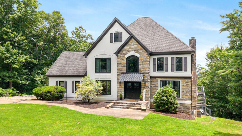 Architecture photography of a stone home exterior with balanced lighting and natural colors.