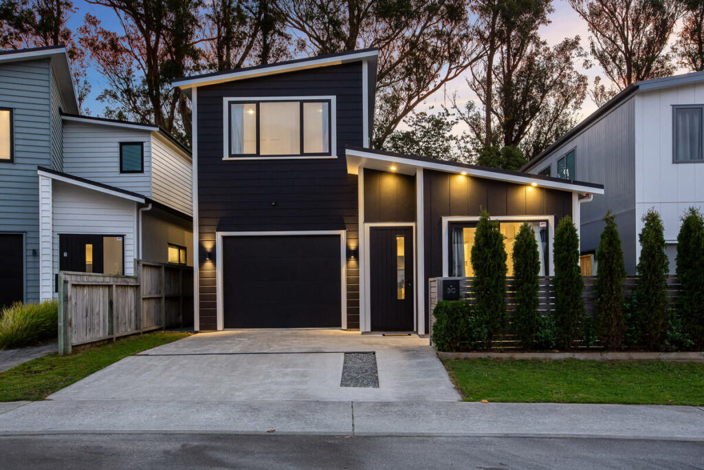 Architecture photography of a modern home exterior with enhanced twilight lighting.