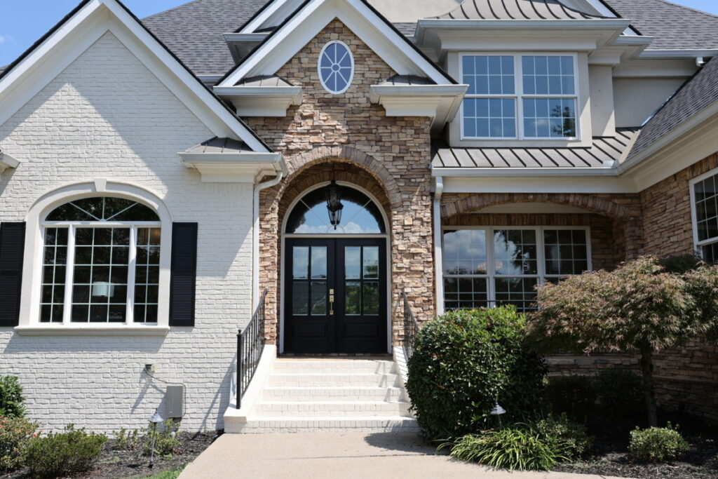 Architecture photography of a luxury home entrance before professional photo editing.