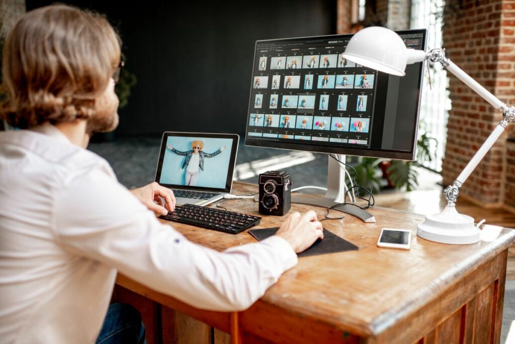 Commercial photographer selecting and reviewing images from a commercial campaign