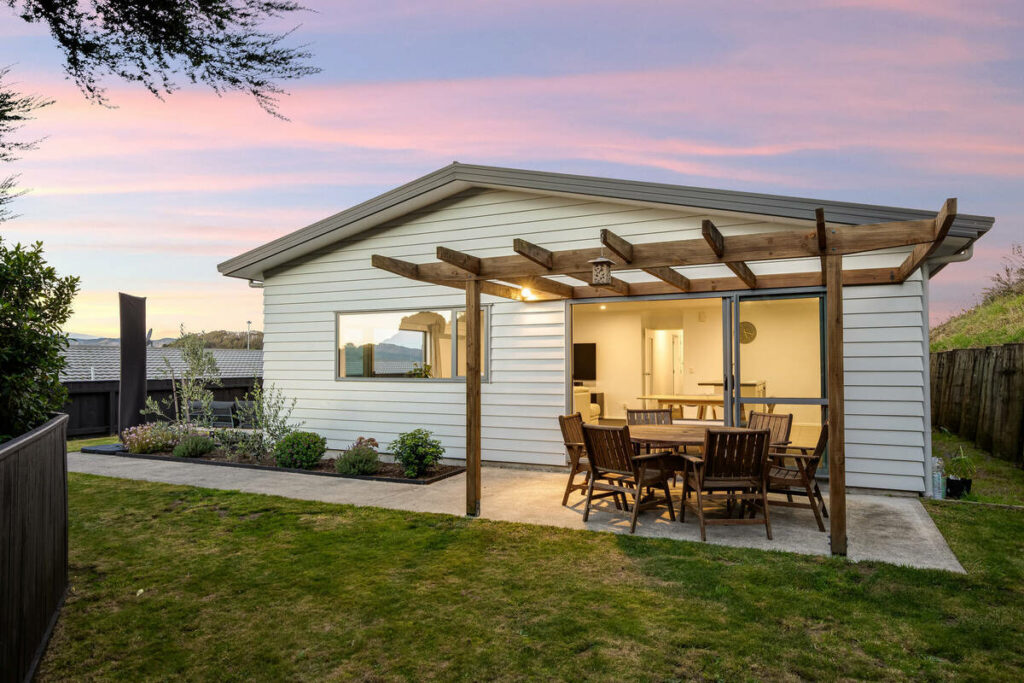 AutoHDR vs AI photo editing example showing an enhanced twilight exterior with balanced lighting