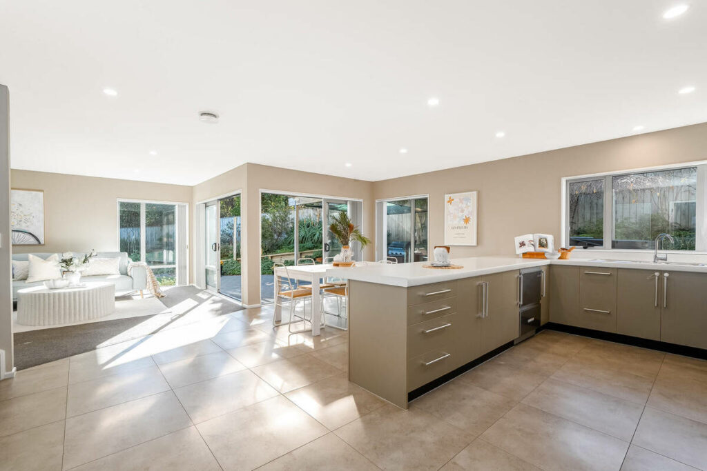 AutoHDR vs AI photo editing example of a bright open-plan kitchen and living area