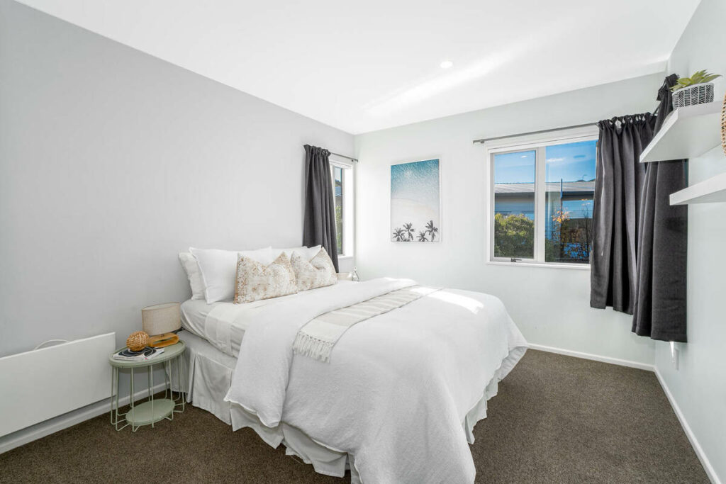 AutoHDR vs AI photo editing example of a bright bedroom with clean exposure and window detail