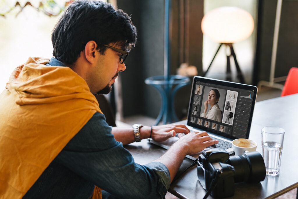 Photographer working on editorial photo editing for a fashion portrait