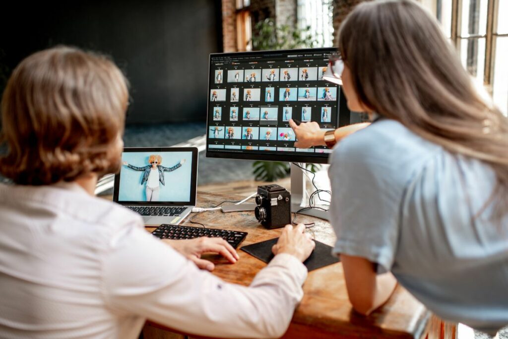 Photography team checking gallery consistency during an AI photo editing review