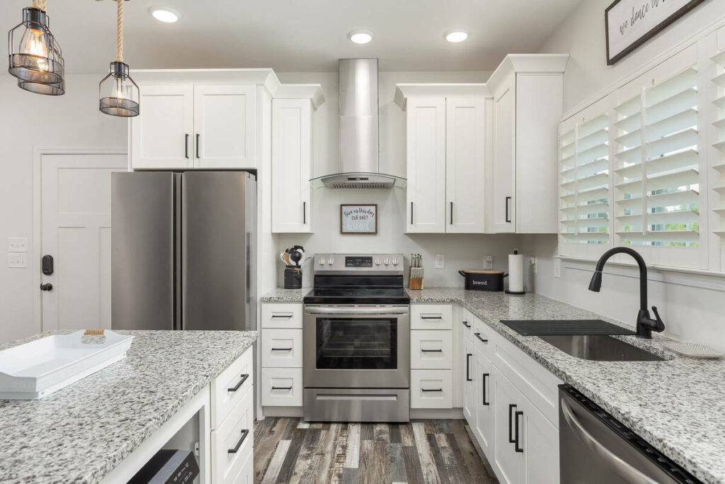 Dodge and burn editing used to balance highlights in a white kitchen