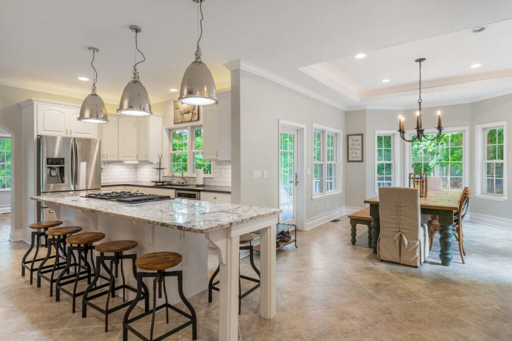 Lens distortion correction on an open kitchen and dining area with balanced architectural lines and proportions.