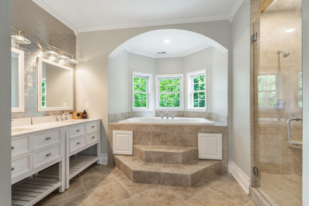 Lens distortion correction applied to a bathroom interior with straight vanity, shower, and window lines.