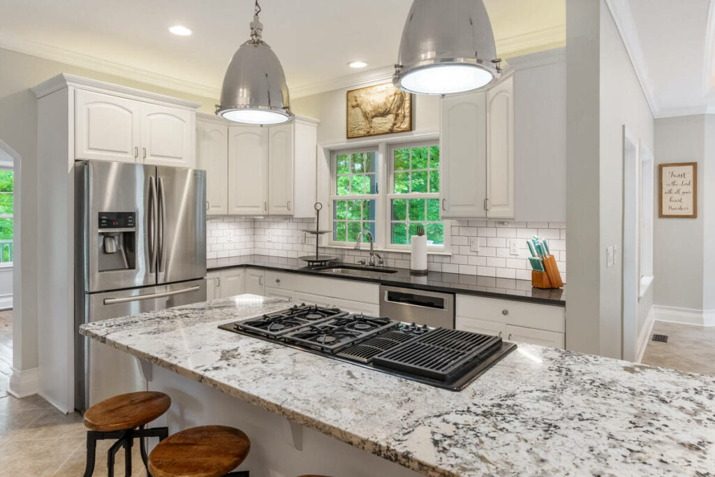 Lens distortion correction on a kitchen with straight cabinets, countertops, windows, and architectural lines.