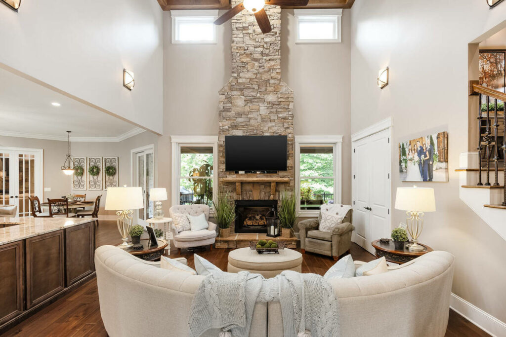 Lens distortion correction on a vaulted living room with a stone fireplace and straight architectural lines.