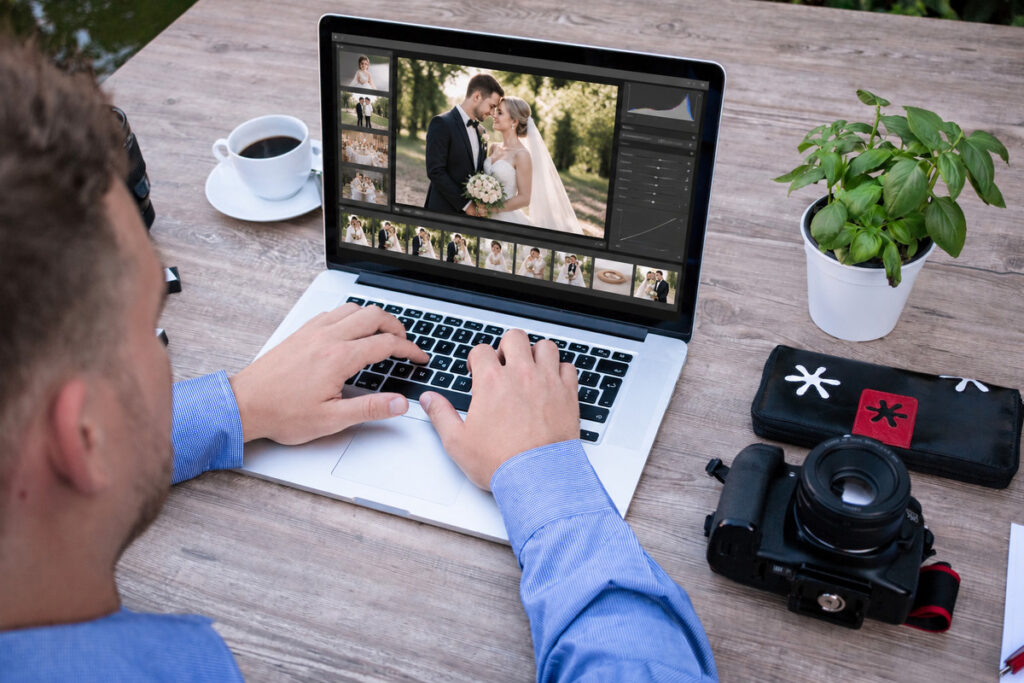 Wedding photographer editing a client gallery as part of a CRM for photographers workflow