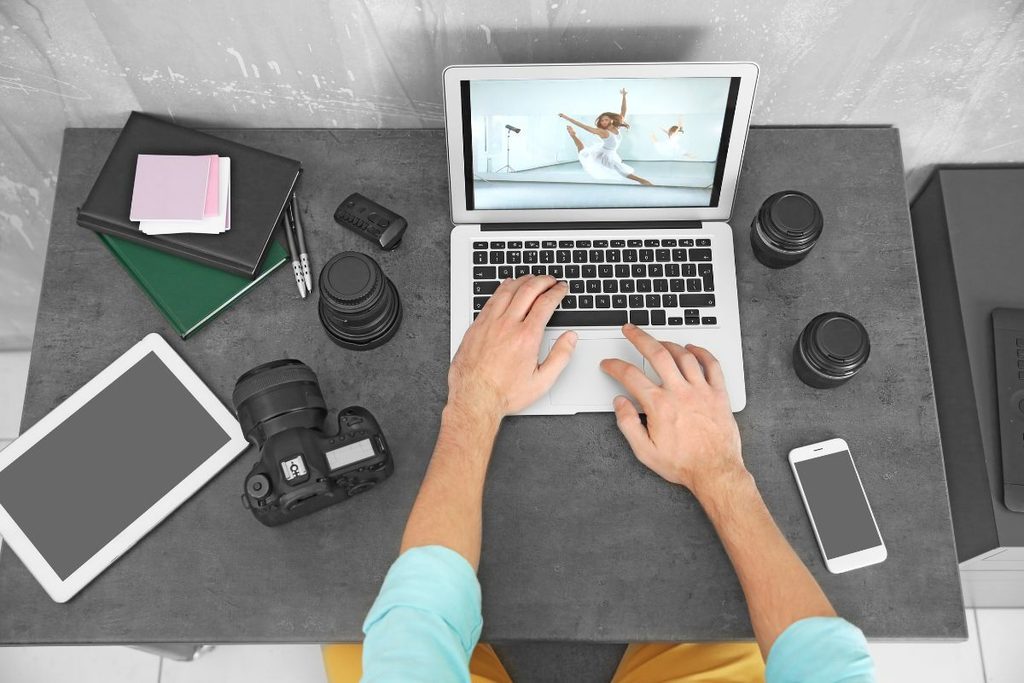 Growth Coordinator workflow with photography equipment and a laptop