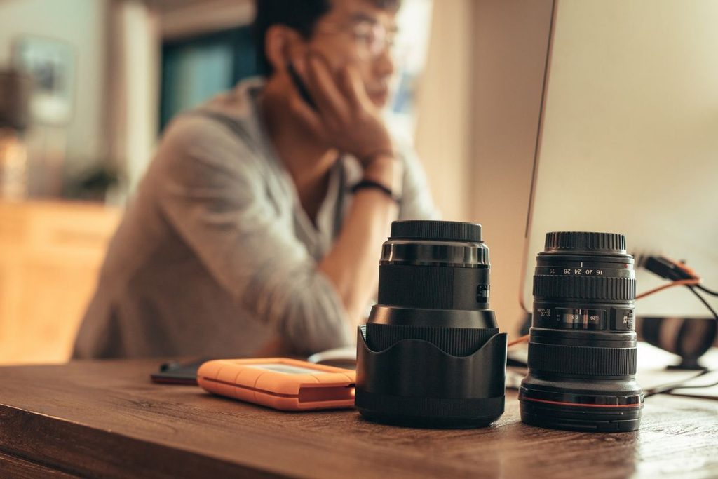 Photography coordinator working with camera gear and photography equipment