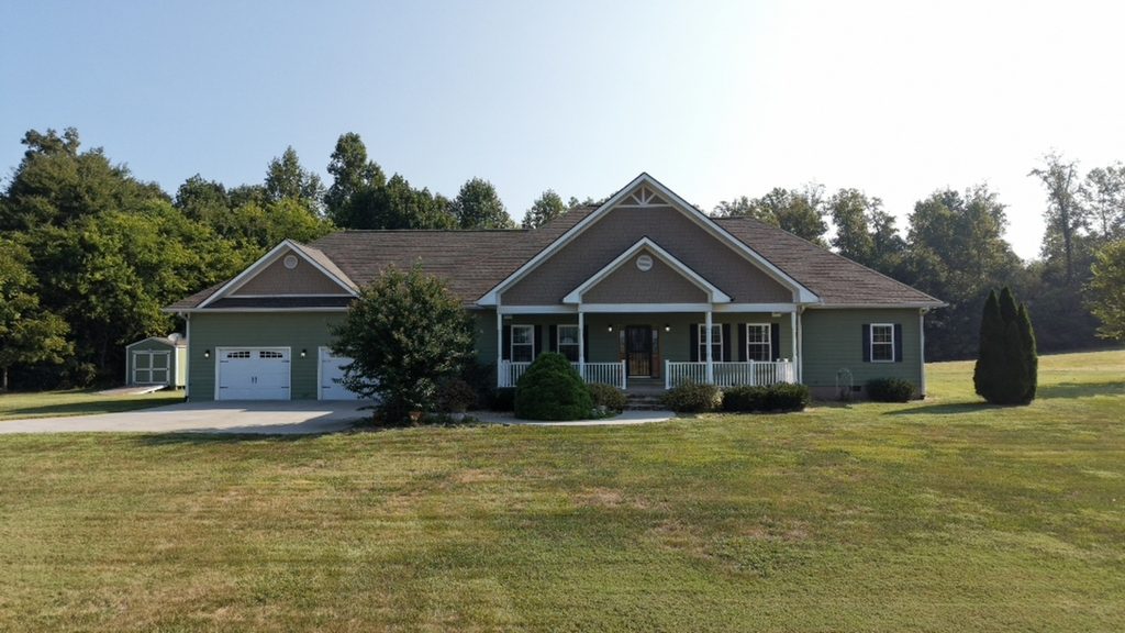 Original home exterior before professional real estate photo editing.