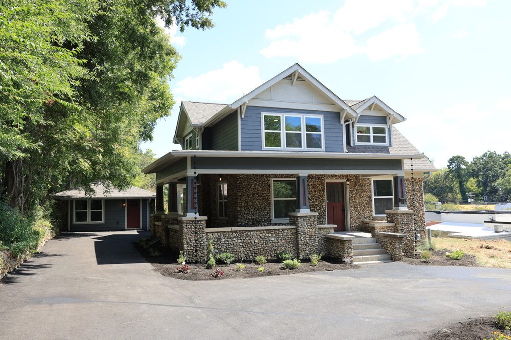 Original exterior property photo before real estate photo editing company enhancements.