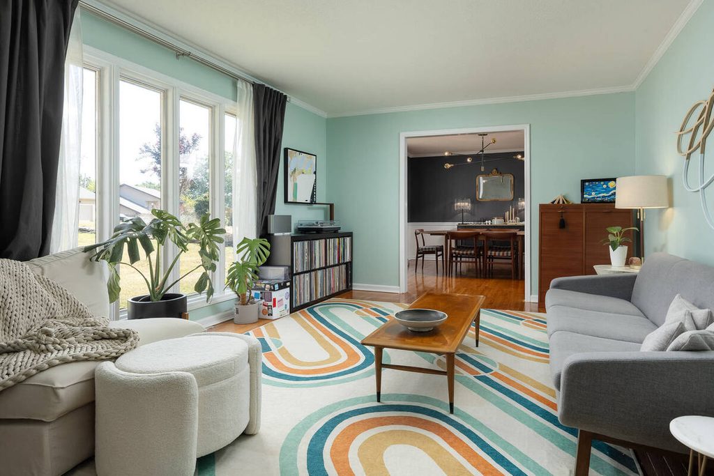 Bright living room professionally enhanced by a real estate photo editing company.