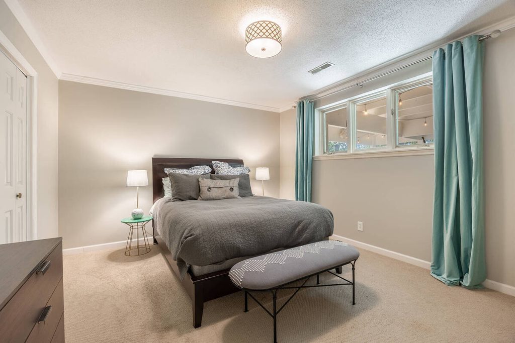 Bedroom photo professionally enhanced by a real estate photo editing company.