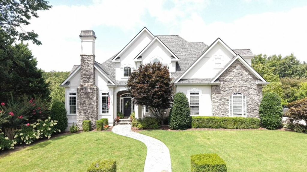 Production coordinator managing a real estate photography property project
