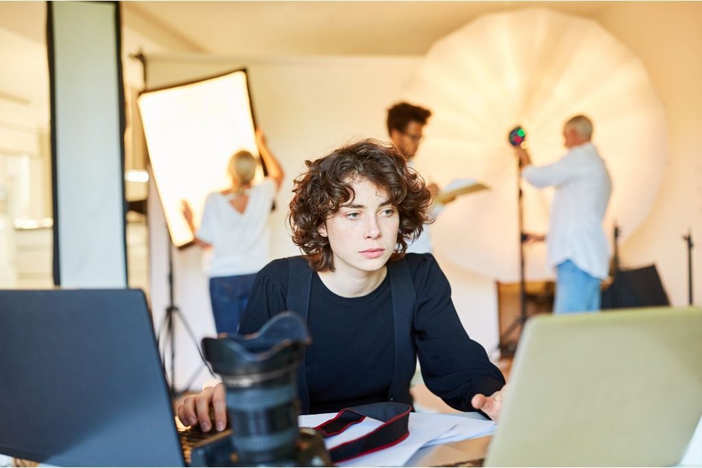 Photographer managing a busy studio workflow to scale a photography business