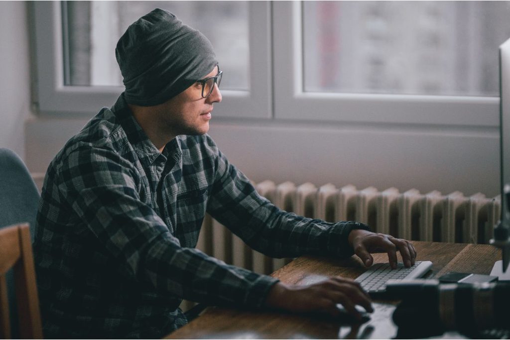 Photographer managing a photography business workflow on a desktop computer