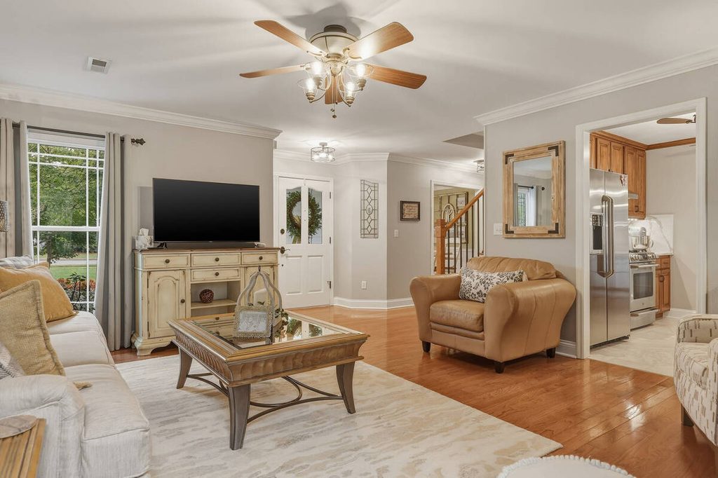 Living room interior with hardwood floors and neutral furniture for AI photo culling.