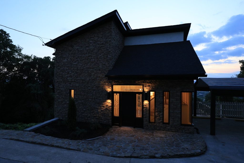 Dark exterior property photo captured at dusk for AI photo culling review.