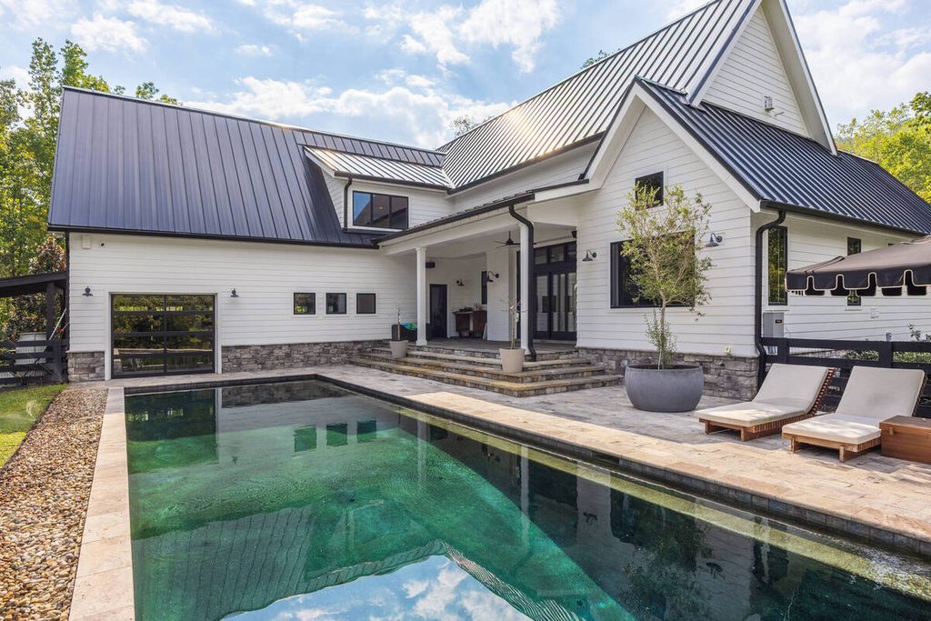 Modern house exterior with a swimming pool reviewed during AI photo culling.