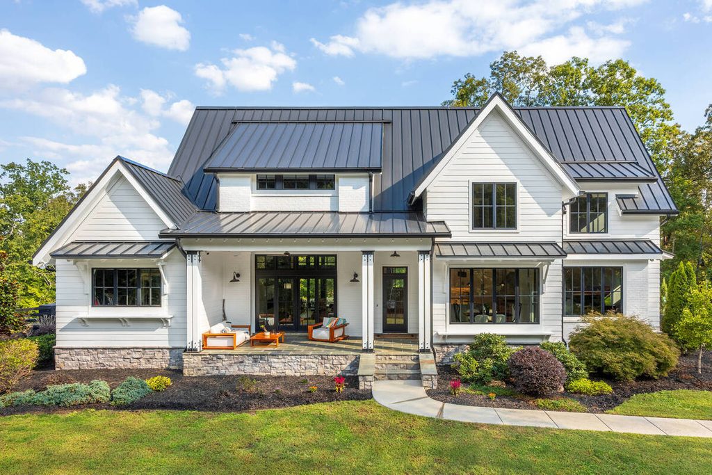 Modern white farmhouse exterior with a landscaped front yard for AI photo culling.