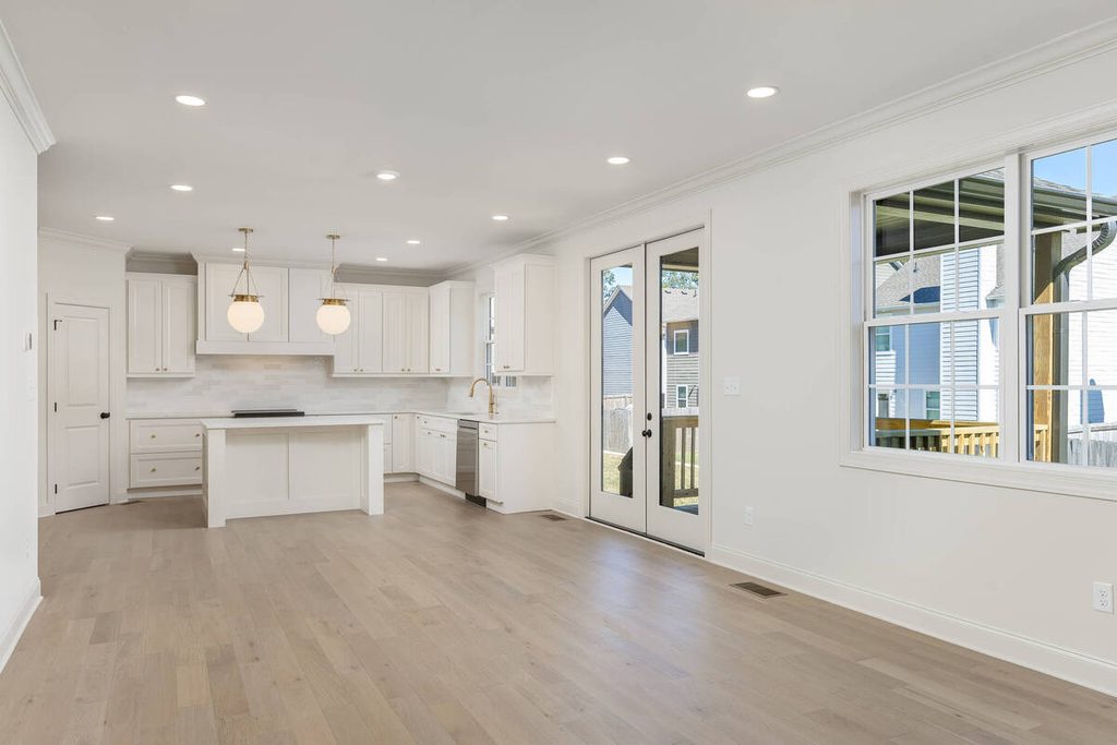 Empty open-concept dining room before virtual staging