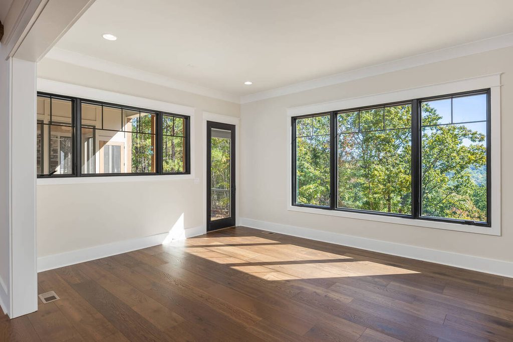 Vacant dining room with large windows before virtual staging