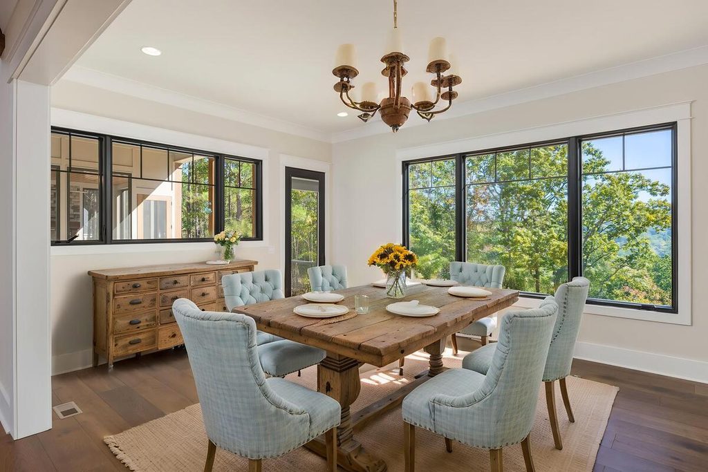 Virtual staging featuring a rustic wooden table and light blue chairs
